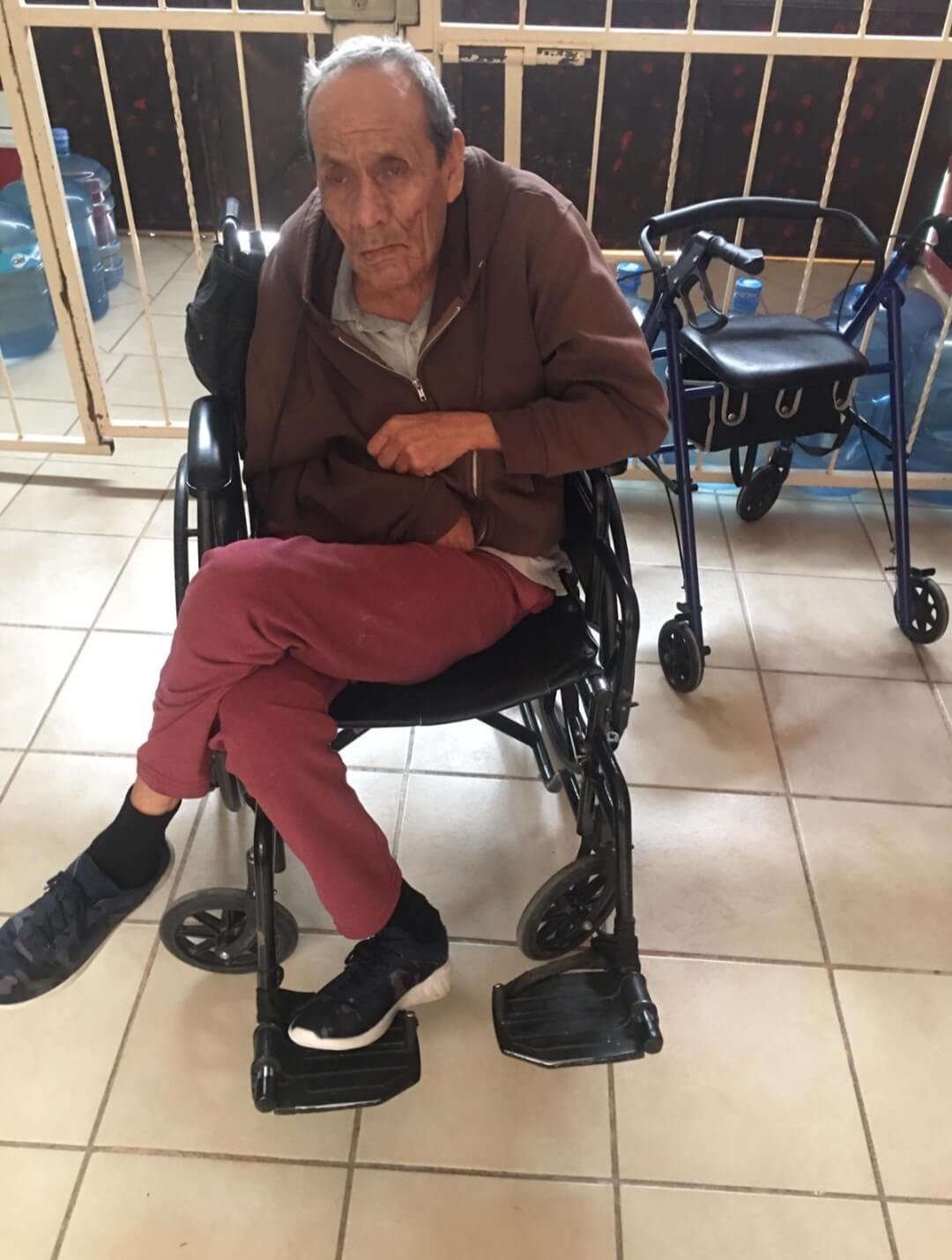 elderly man sitting in a wheelchair