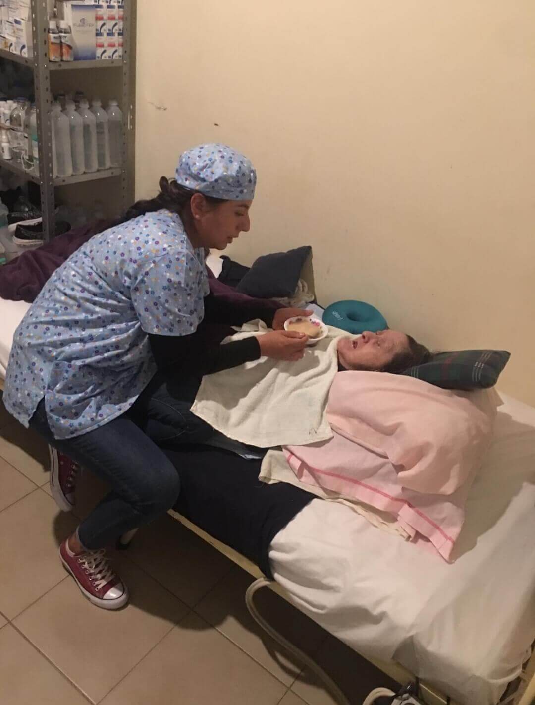nurse feeding an elderly resident