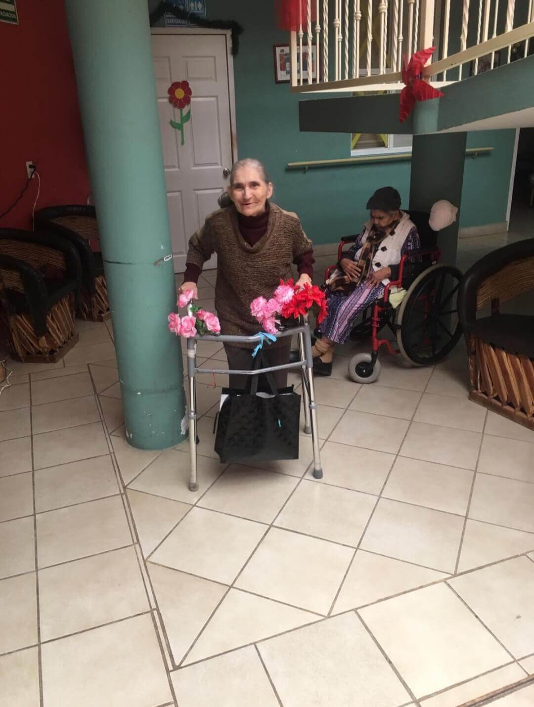Resident walking with her walker