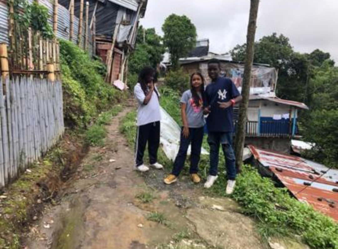 children standing in their neighborhood