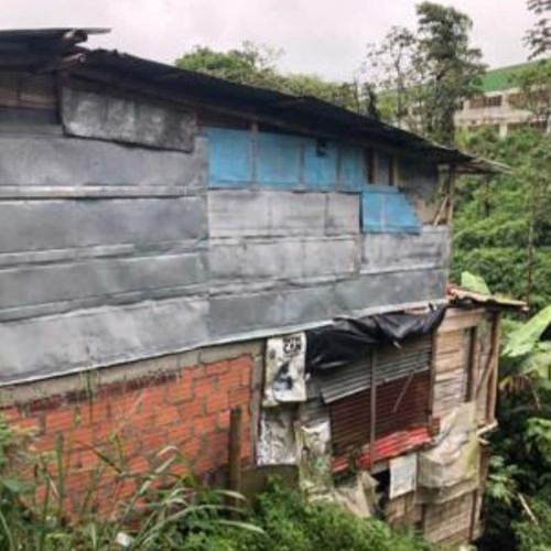 thumbnail of multi-story shacks in colombia