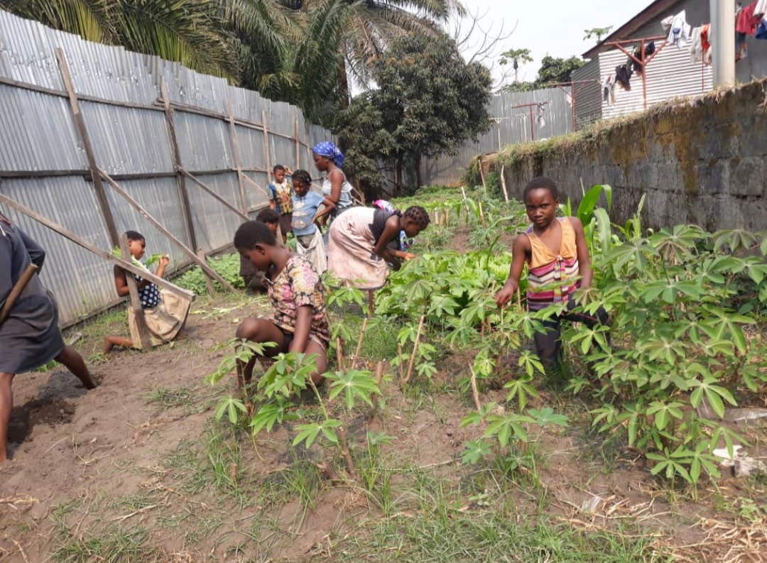 children working in a garden