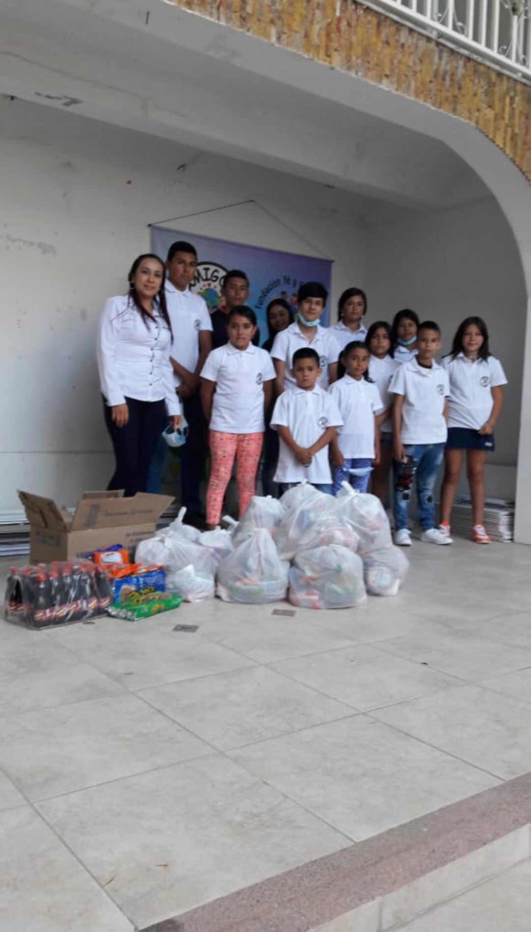 a teacher posing with students
