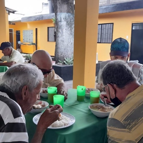 thumbnail of a table of men eating food
