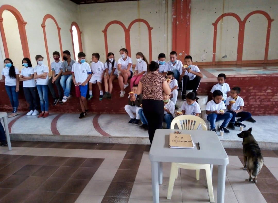 children sitting and eating food