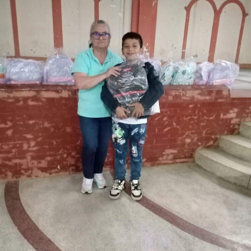 thumbnail of a boy receives a backpack