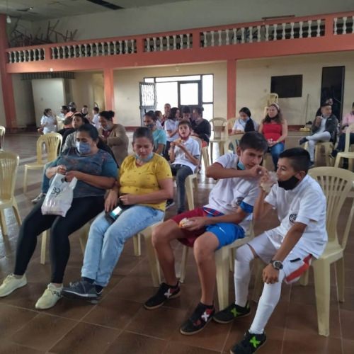 thumbnail of people sitting in a school center