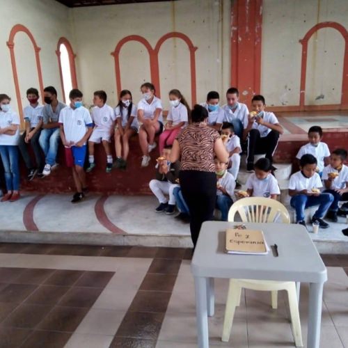 thumbnail of children sitting and eating food